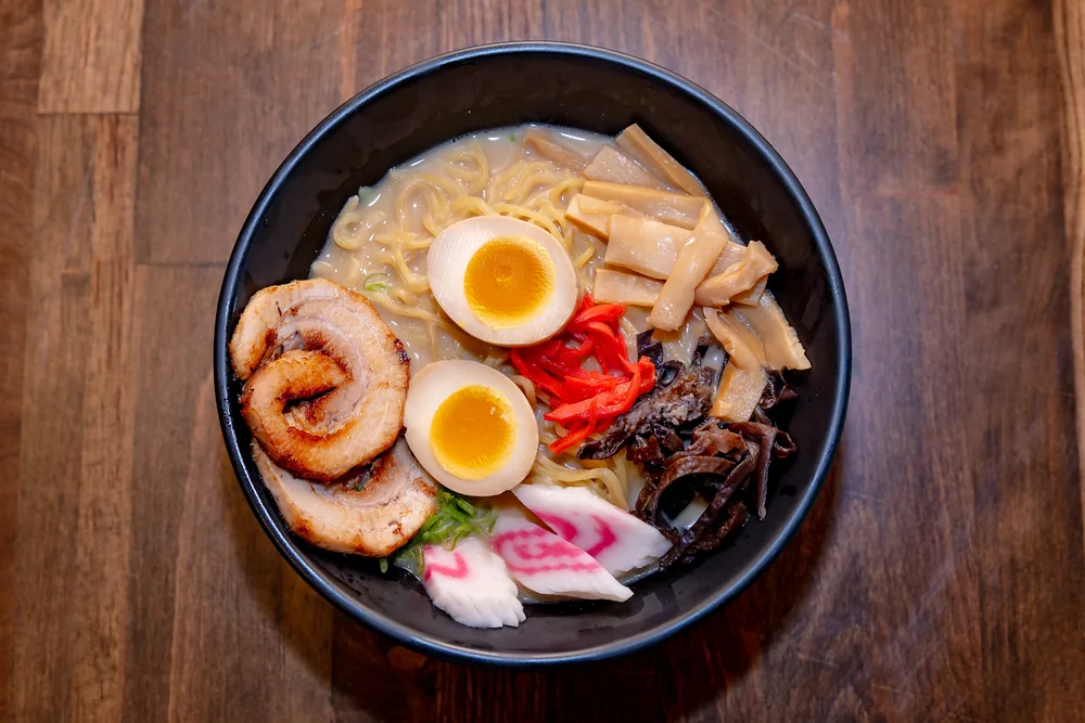 Miso ramen with chashu pork, halved soft-boiled egg, bamboo shoots, wood ear mushroom and pickled ginger